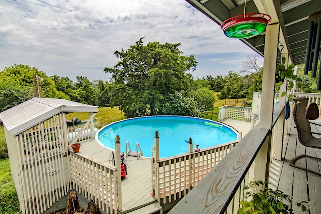 1746 Wall Rd, Mountain Grove, MO 65711 - outdoor pool featuring a wooden deck and view of wooded area