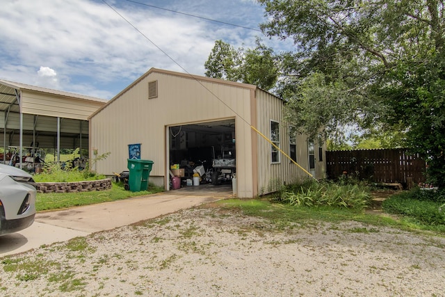 1746 Wall Rd, Mountain Grove, MO 65711 - view of outdoor structure with a garage and concrete driveway