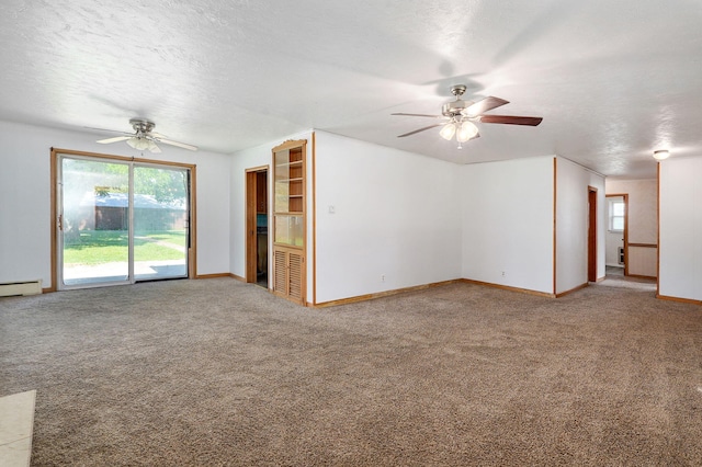 304 N Main St, Lockwood, MO 65682 - unfurnished living room with ceiling fan, carpet, a textured ceiling, and baseboard heating