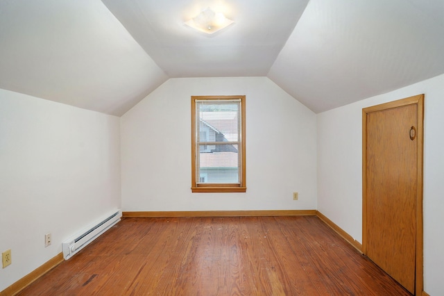 304 N Main St, Lockwood, MO 65682 - additional living space with a baseboard heating unit, wood finished floors, and lofted ceiling