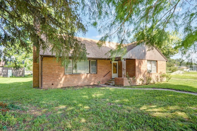 304 N Main St, Lockwood, MO 65682 - ranch-style home with a front lawn, brick siding, and a shingled roof
