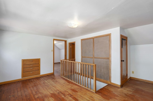 304 N Main St, Lockwood, MO 65682 - additional living space with hardwood / wood-style floors and vaulted ceiling