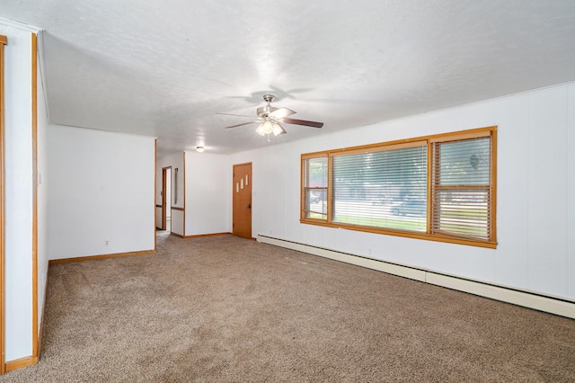304 N Main St, Lockwood, MO 65682 - carpeted spare room with a baseboard radiator and ceiling fan