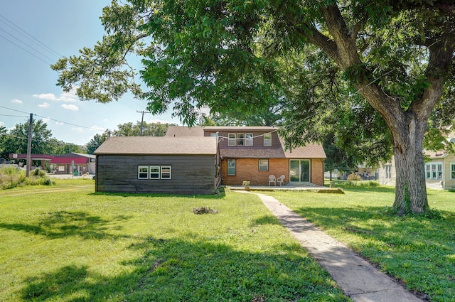 304 N Main St, Lockwood, MO 65682 - view of front of house with a patio, a front lawn, and a balcony