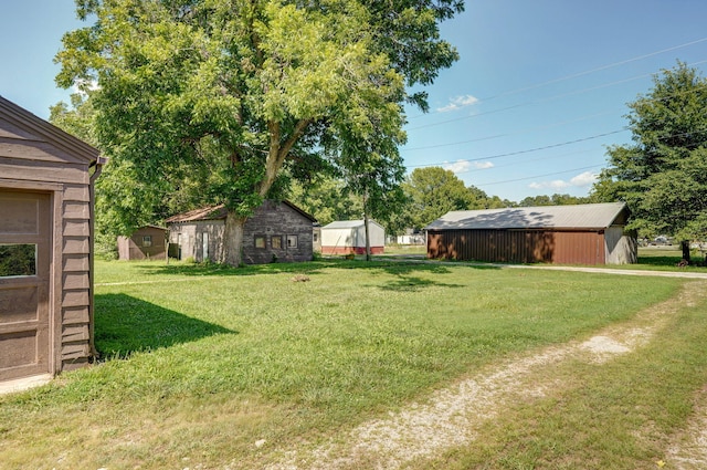 304 N Main St, Lockwood, MO 65682 - view of grassy yard with an outbuilding