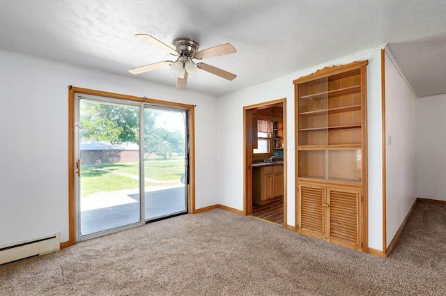 304 N Main St, Lockwood, MO 65682 - unfurnished bedroom featuring a baseboard radiator, access to exterior, carpet floors, ornamental molding, and ceiling fan