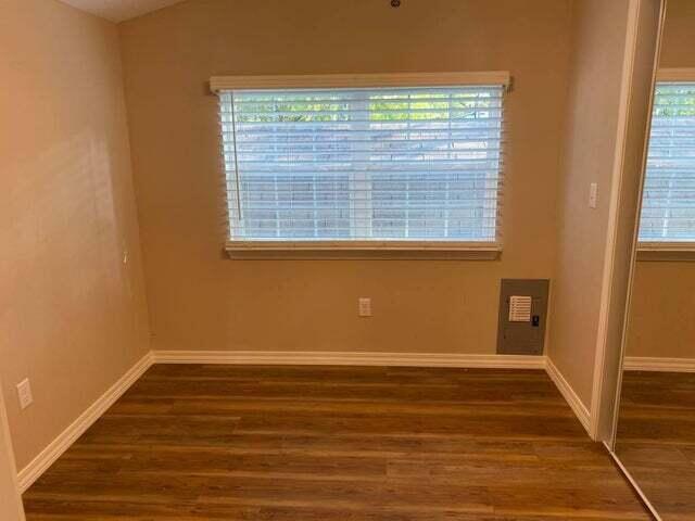 203 Forest Park Ln, Branson, MO 65616 - spare room with wood finished floors and baseboards