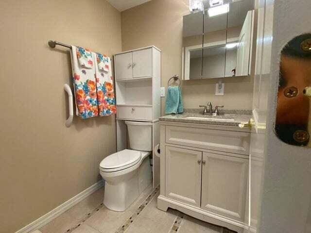 203 Forest Park Ln, Branson, MO 65616 - bathroom featuring vanity and tile patterned flooring