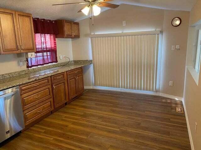 203 Forest Park Ln, Branson, MO 65616 - kitchen with dishwasher, ceiling fan, and dark wood-type flooring