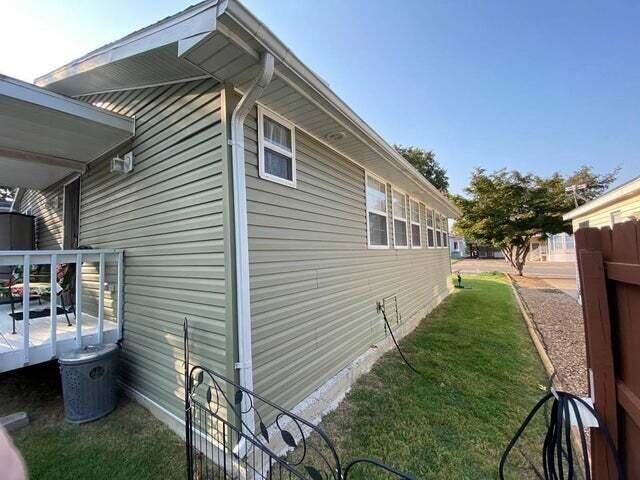 203 Forest Park Ln, Branson, MO 65616 - view of home's exterior featuring a deck and a lawn