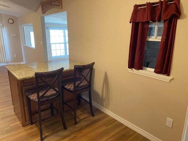 203 Forest Park Ln, Branson, MO 65616 - dining room with wood finished floors and baseboards