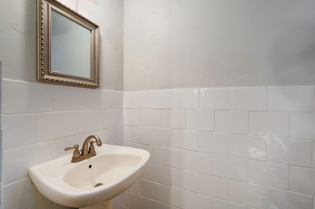 225 S Main St, Greenfield, MO 65661 - bathroom featuring a sink and tile walls