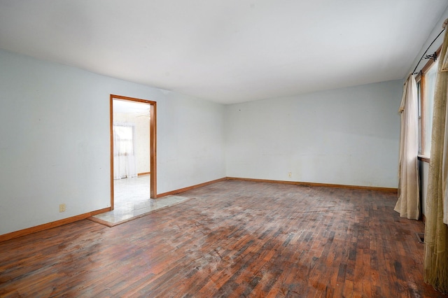 225 S Main St, Greenfield, MO 65661 - empty room with wood finished floors and baseboards