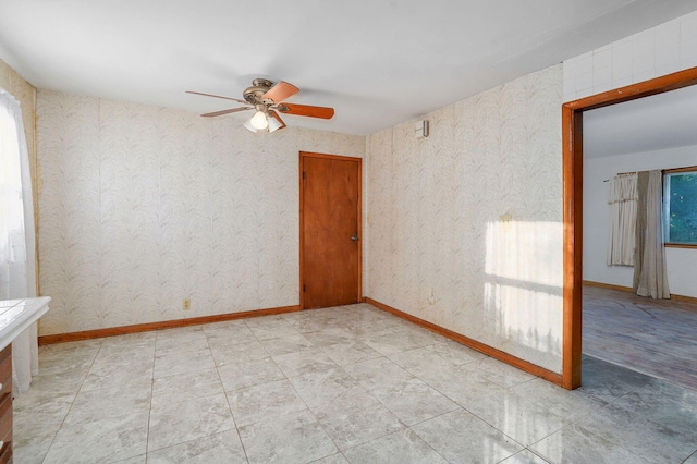 225 S Main St, Greenfield, MO 65661 - unfurnished room featuring ceiling fan and wallpapered walls