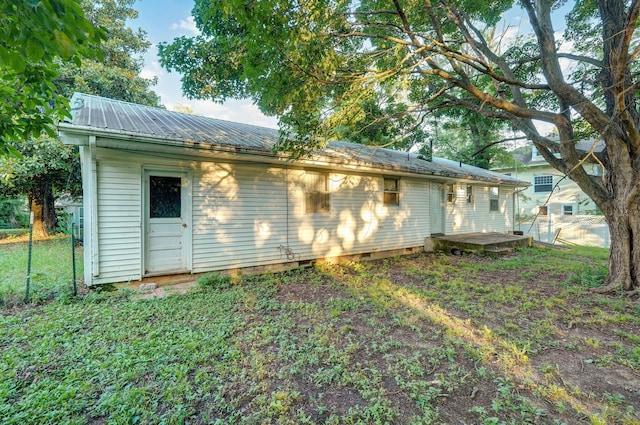 225 S Main St, Greenfield, MO 65661 - rear view of property with a metal roof