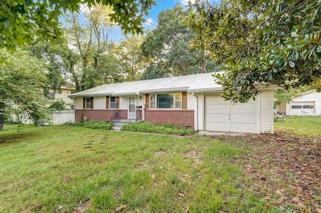 225 S Main St, Greenfield, MO 65661 - single story home with brick siding, an attached garage, a front lawn, and a metal roof