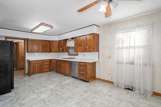 225 S Main St, Greenfield, MO 65661 - kitchen with dishwasher, freestanding refrigerator, brown cabinets, ceiling fan, and light countertops