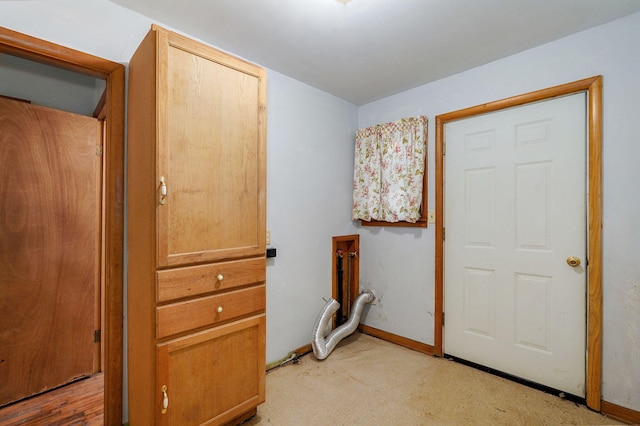 225 S Main St, Greenfield, MO 65661 - laundry room with baseboards and light colored carpet