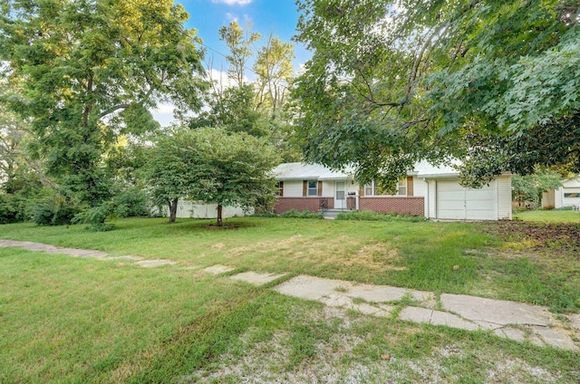 225 S Main St, Greenfield, MO 65661 - view of grassy yard with an attached garage