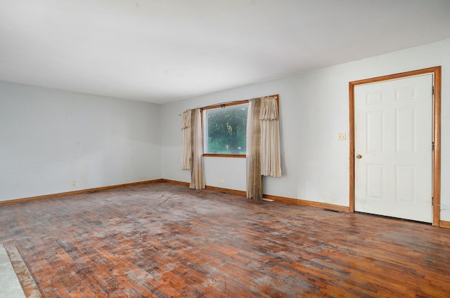 225 S Main St, Greenfield, MO 65661 - empty room featuring wood finished floors and baseboards