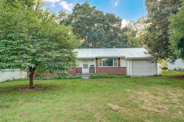 225 S Main St, Greenfield, MO 65661 - ranch-style house with an attached garage, brick siding, and a metal roof