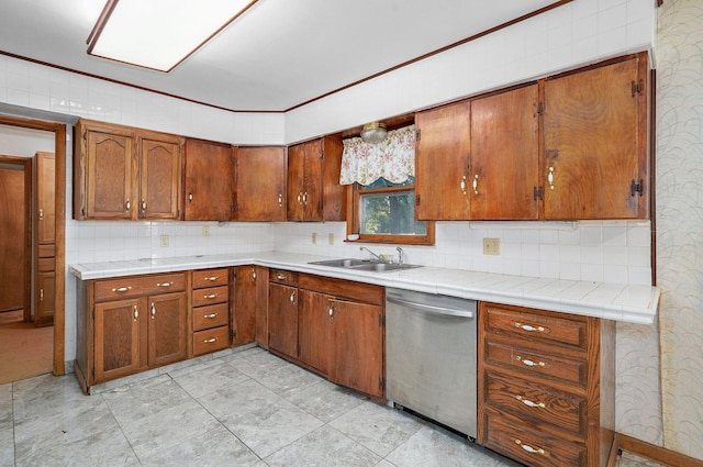 225 S Main St, Greenfield, MO 65661 - kitchen with stainless steel dishwasher, backsplash, and brown cabinetry
