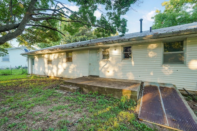 225 S Main St, Greenfield, MO 65661 - rear view of property with a metal roof