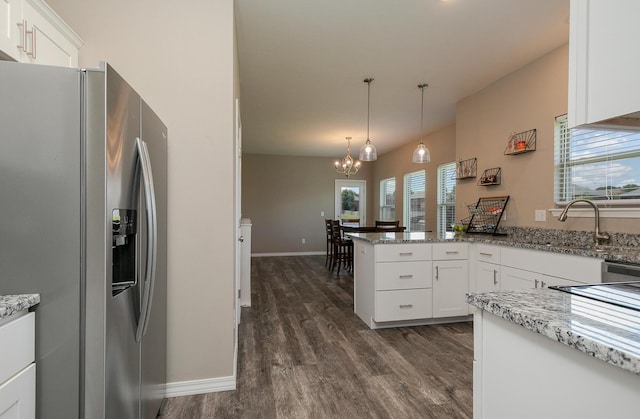 1929 N Brookhollow Dr, Nixa, MO 65714 - kitchen featuring stainless steel fridge, a chandelier, a peninsula, dark wood-style floors, and white cabinets