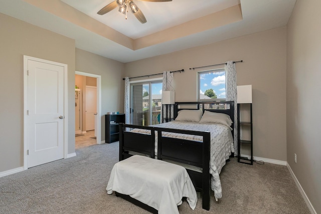 1929 N Brookhollow Dr, Nixa, MO 65714 - carpeted bedroom with a raised ceiling, access to exterior, and ceiling fan