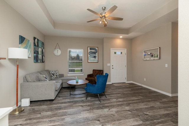 1929 N Brookhollow Dr, Nixa, MO 65714 - living room featuring a tray ceiling, wood finished floors, a ceiling fan, and recessed lighting