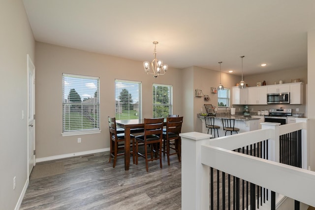 1929 N Brookhollow Dr, Nixa, MO 65714 - dining area featuring wood finished floors, a chandelier, and recessed lighting