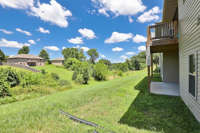 1929 N Brookhollow Dr, Nixa, MO 65714 - view of green lawn featuring a balcony and a patio