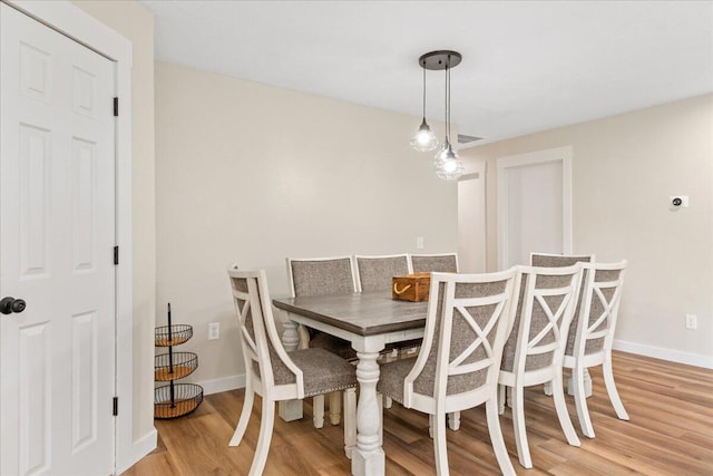 103 W Secluded Ln, Nixa, MO 65714 - dining room featuring light wood-style flooring and baseboards