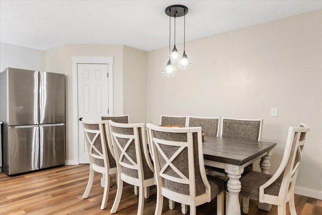 103 W Secluded Ln, Nixa, MO 65714 - dining area featuring light wood finished floors and baseboards