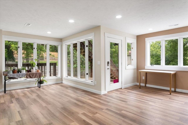 103 W Secluded Ln, Nixa, MO 65714 - unfurnished sunroom featuring wood finished floors, recessed lighting, and a textured ceiling