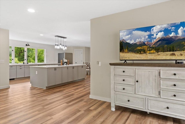 103 W Secluded Ln, Nixa, MO 65714 - living area featuring light wood finished floors, a chandelier, and recessed lighting