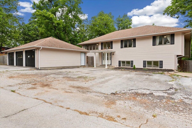 103 W Secluded Ln, Nixa, MO 65714 - view of front of property with a detached garage and an outbuilding