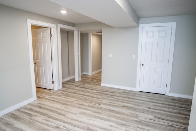 1719 N Pine St, Marshfield, MO 65706 - finished basement with light wood-style flooring and recessed lighting