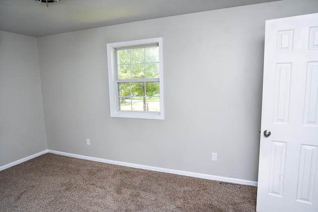1719 N Pine St, Marshfield, MO 65706 - spare room featuring carpet flooring and baseboards