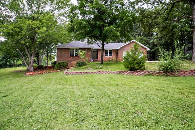 1719 N Pine St, Marshfield, MO 65706 - ranch-style house featuring brick siding and a front yard