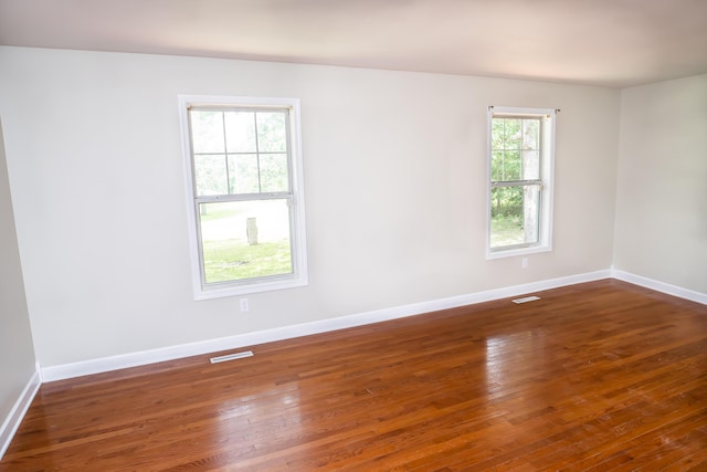 1719 N Pine St, Marshfield, MO 65706 - empty room featuring hardwood / wood-style floors and baseboards
