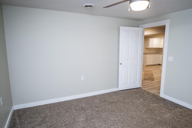 1719 N Pine St, Marshfield, MO 65706 - spare room featuring carpet floors and a ceiling fan