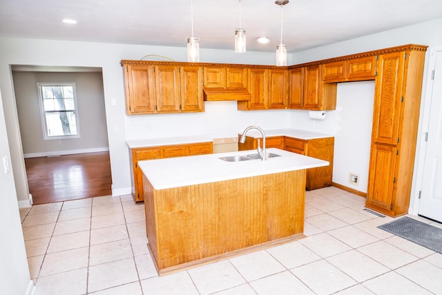 1719 N Pine St, Marshfield, MO 65706 - kitchen featuring light countertops, light tile patterned flooring, brown cabinets, decorative light fixtures, and recessed lighting