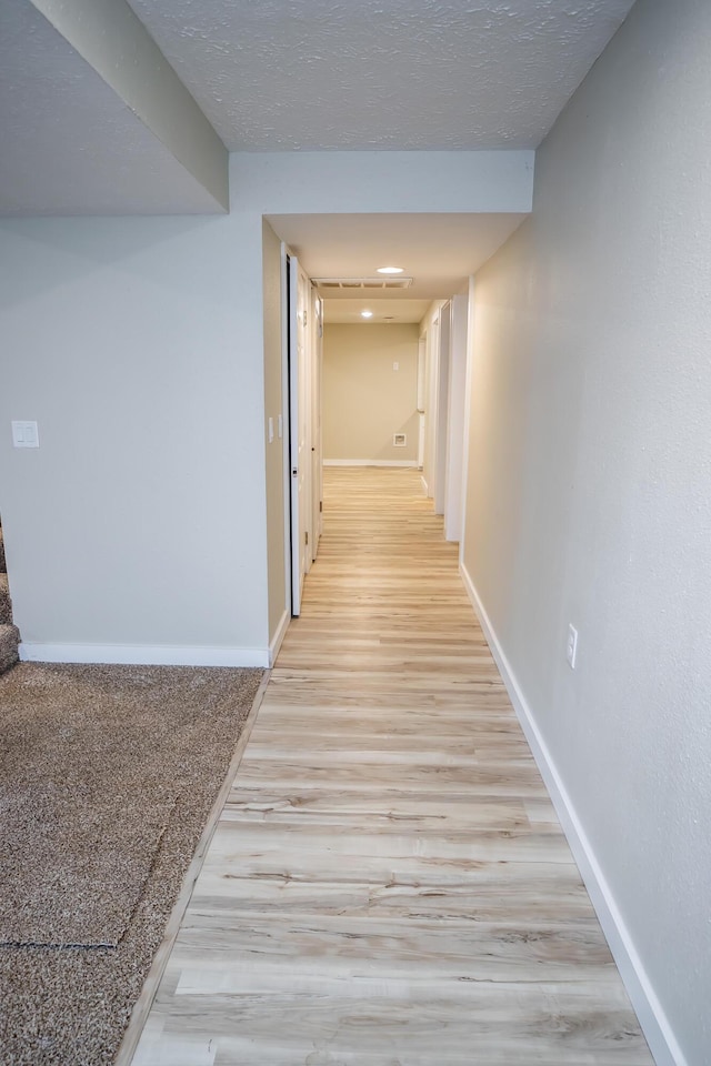 1719 N Pine St, Marshfield, MO 65706 - corridor featuring light wood finished floors and baseboards