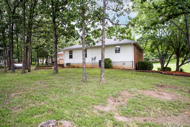 1719 N Pine St, Marshfield, MO 65706 - rear view of property featuring a lawn