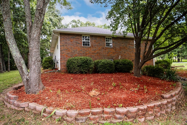 1719 N Pine St, Marshfield, MO 65706 - view of side of home with brick siding