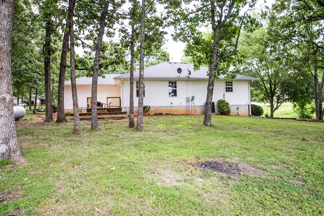 1719 N Pine St, Marshfield, MO 65706 - rear view of property featuring a deck and a lawn