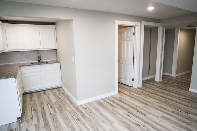 1719 N Pine St, Marshfield, MO 65706 - kitchen featuring light wood-type flooring, tasteful backsplash, white cabinetry, stone counters, and recessed lighting