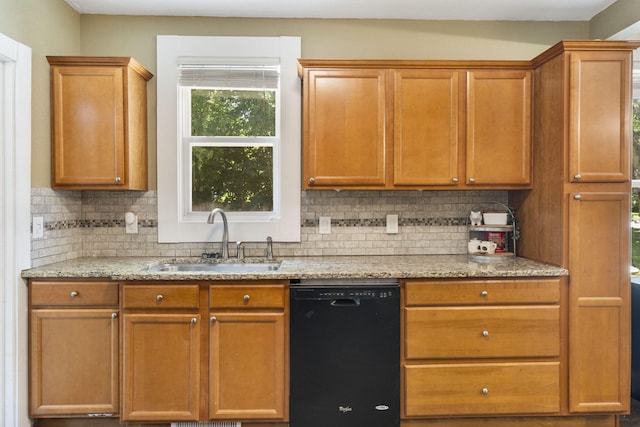 526 S Mccanse St, Mount Vernon, MO 65712 - kitchen with dishwasher, decorative backsplash, light stone countertops, and brown cabinets