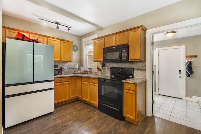 526 S Mccanse St, Mount Vernon, MO 65712 - kitchen with black appliances, backsplash, light stone counters, and dark wood-style flooring